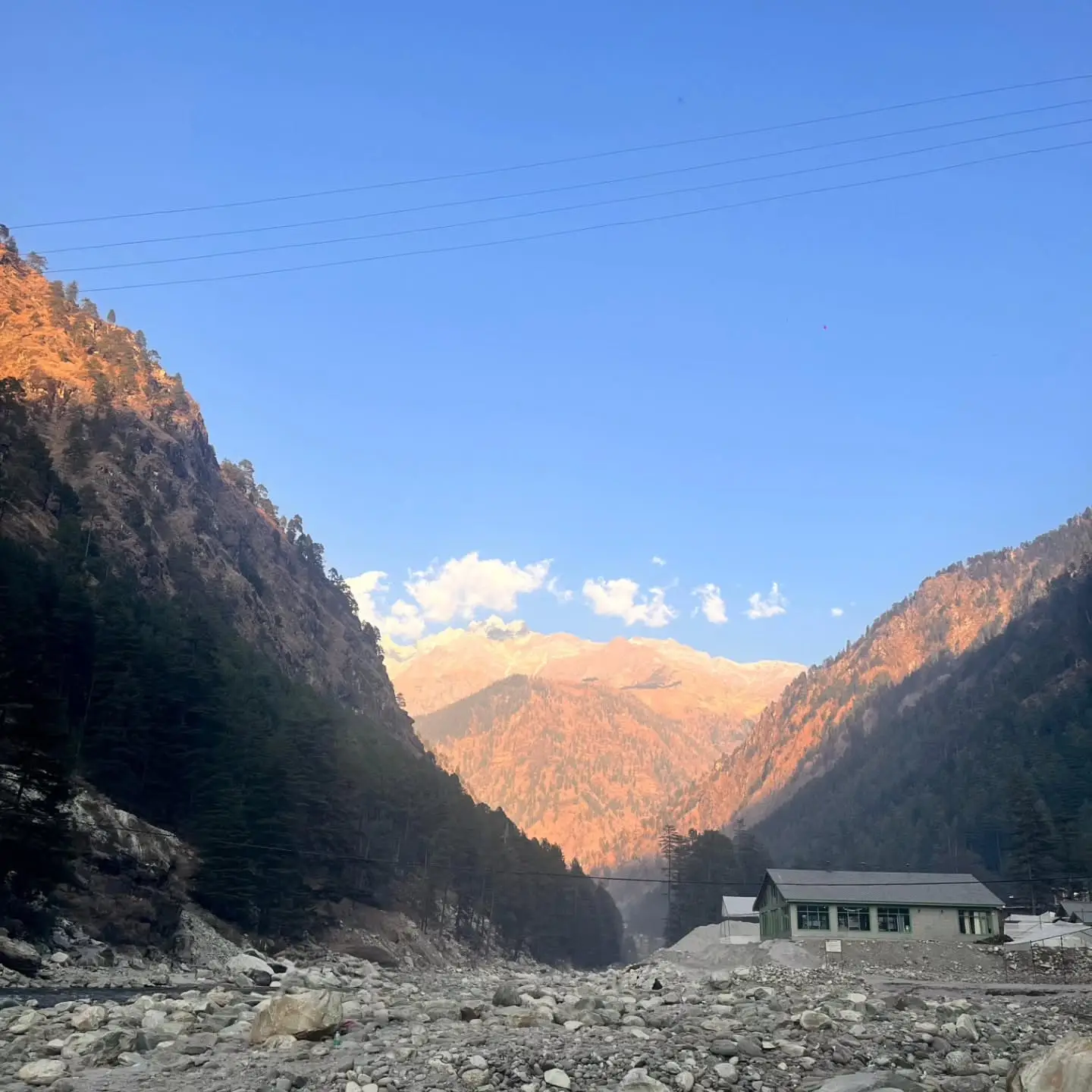 Morning light on a Himalayan valley with a dry riverbed